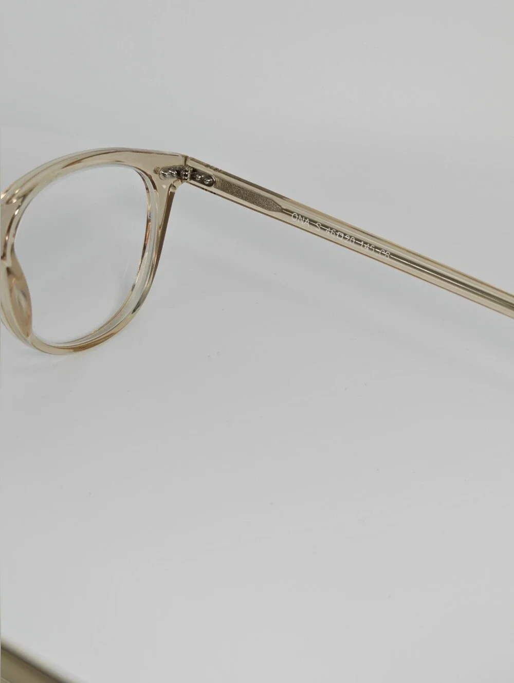 Ona. RFLKT. Clear Beige Round Frame Glasses.
